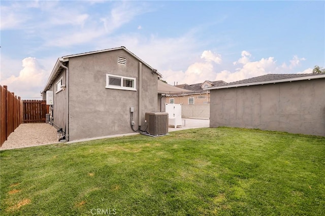 2804 W 84th St, Inglewood, CA 90305 - rear view of property with central AC, a patio area, and stucco siding