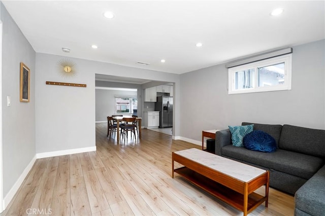 2804 W 84th St, Inglewood, CA 90305 - living room featuring light wood-type flooring, recessed lighting, and baseboards