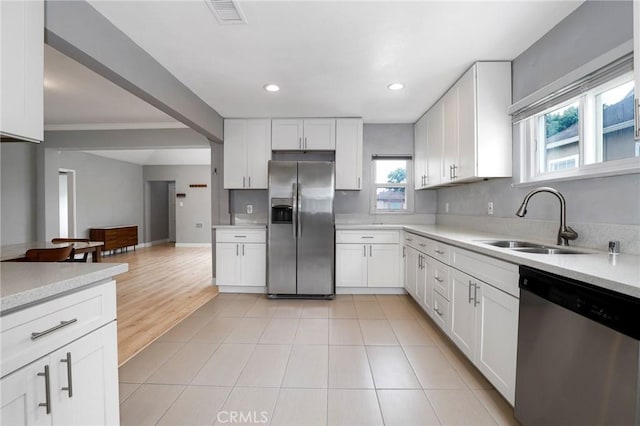 2804 W 84th St, Inglewood, CA 90305 - kitchen featuring stainless steel appliances, a sink, healthy amount of natural light, light countertops, and recessed lighting