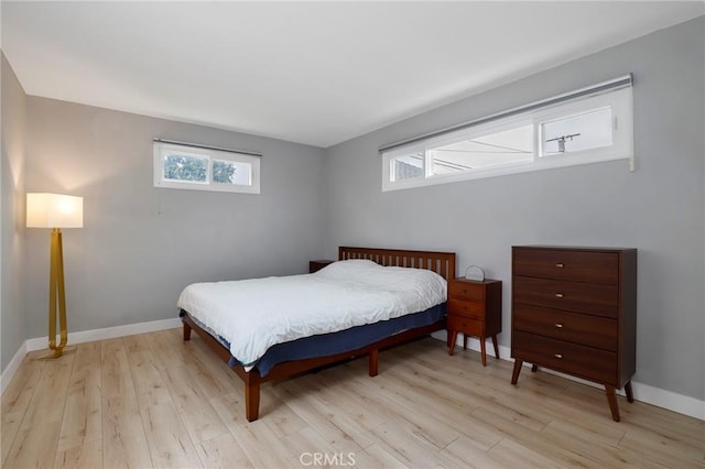 2804 W 84th St, Inglewood, CA 90305 - bedroom with light wood-style flooring, multiple windows, and baseboards