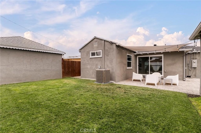 2804 W 84th St, Inglewood, CA 90305 - rear view of property featuring central air condition unit, a patio area, and stucco siding
