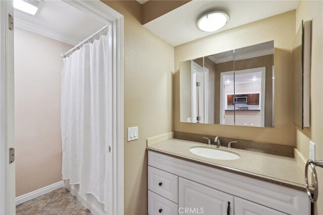 310 S Miraleste Dr Unit 69, San Pedro, CA 90732 - bathroom featuring vanity, ornamental molding, curtained shower, and baseboards