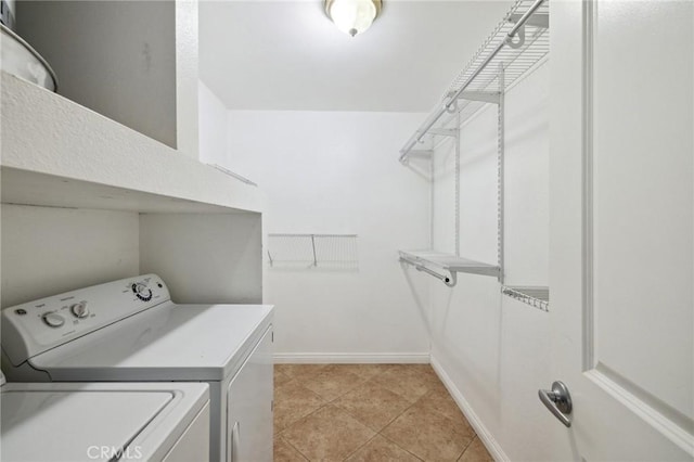 310 S Miraleste Dr Unit 69, San Pedro, CA 90732 - laundry room featuring independent washer and dryer, baseboards, and light tile patterned floors