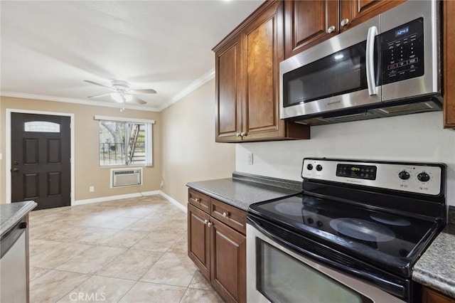 310 S Miraleste Dr Unit 69, San Pedro, CA 90732 - kitchen featuring stainless steel appliances, crown molding, a wall unit AC, light tile patterned floors, and a ceiling fan