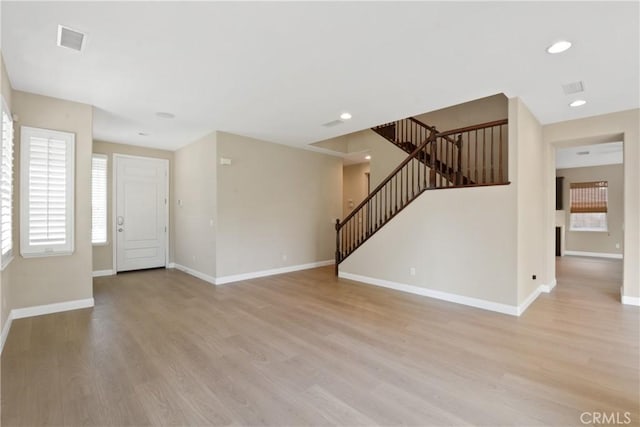 12632 Chimney Rock Dr, Rancho Cucamonga, CA 91739 - unfurnished living room with stairway, plenty of natural light, baseboards, light wood-style flooring, and recessed lighting