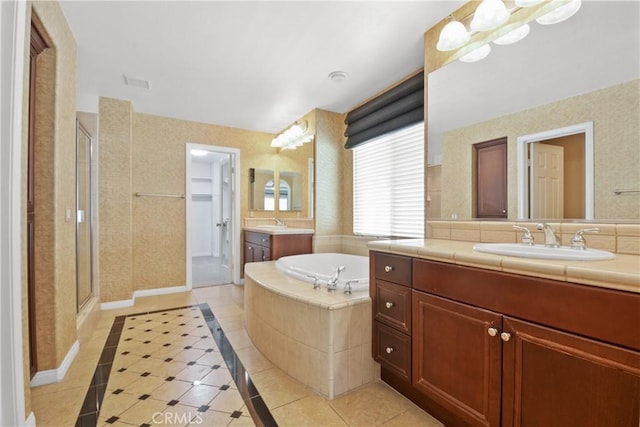 12632 Chimney Rock Dr, Rancho Cucamonga, CA 91739 - full bath featuring a stall shower, tile patterned flooring, two vanities, a bath, and inlaid floor details