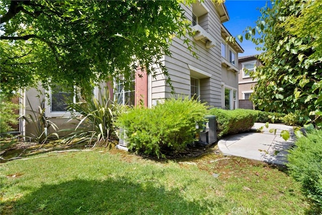 12632 Chimney Rock Dr, Rancho Cucamonga, CA 91739 - view of grassy yard with cooling unit and a patio area