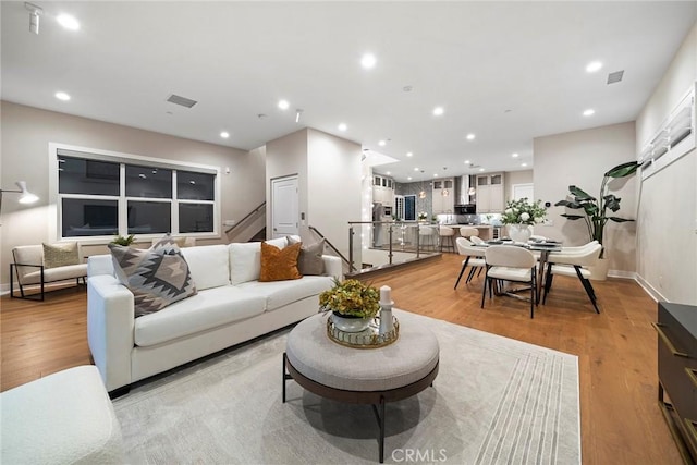 26290 Paseo Sillin, San Juan Capistrano, CA 92675 - living area with light wood finished floors, baseboards, and recessed lighting