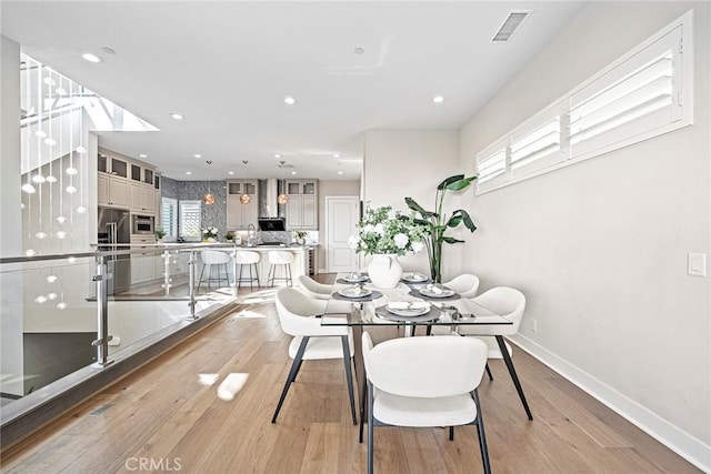 26290 Paseo Sillin, San Juan Capistrano, CA 92675 - dining space with light wood-style flooring, baseboards, and recessed lighting