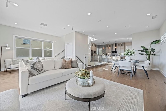 26290 Paseo Sillin, San Juan Capistrano, CA 92675 - living room with light wood-type flooring, recessed lighting, and baseboards