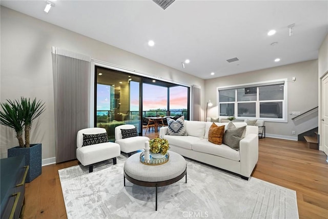 26290 Paseo Sillin, San Juan Capistrano, CA 92675 - living room featuring wood finished floors, baseboards, recessed lighting, and stairway