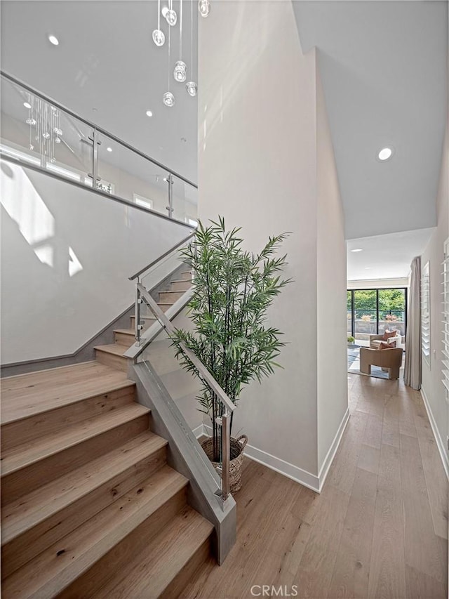 26290 Paseo Sillin, San Juan Capistrano, CA 92675 - stairs featuring baseboards, wood finished floors, and recessed lighting