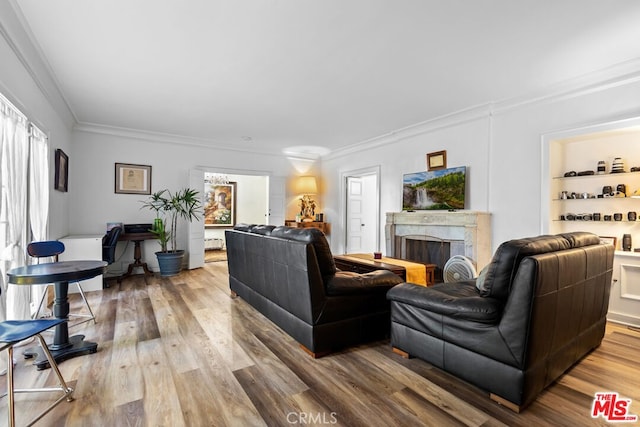 728 S Windsor Blvd, Los Angeles, CA 90005 - living area featuring crown molding, wood finished floors, and a premium fireplace