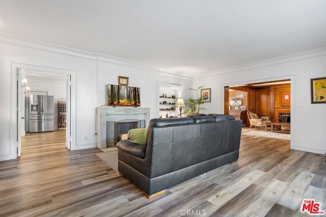 728 S Windsor Blvd, Los Angeles, CA 90005 - living area with ornamental molding, wood finished floors, and a high end fireplace