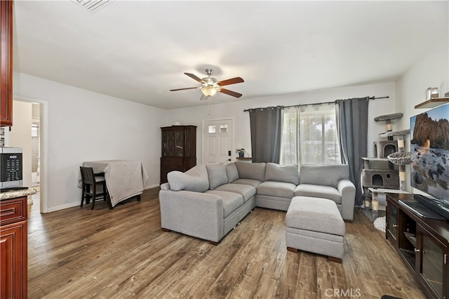 3075 Ronald, Riverside, CA 92506 - living room with a ceiling fan, wood finished floors, and baseboards