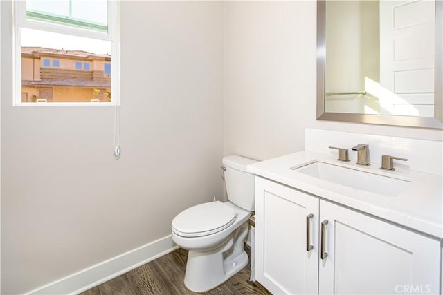 71 Einstein Way, Irvine, CA 92618 - bathroom with toilet, vanity, wood finished floors, and baseboards