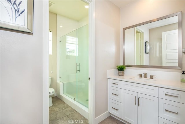 71 Einstein Way, Irvine, CA 92618 - bathroom featuring toilet, vanity, a stall shower, tile patterned flooring, and baseboards