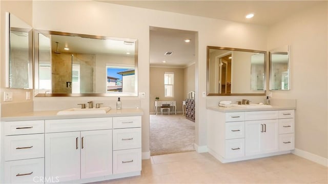 71 Einstein Way, Irvine, CA 92618 - bathroom with baseboards, two vanities, crown molding, recessed lighting, and a shower
