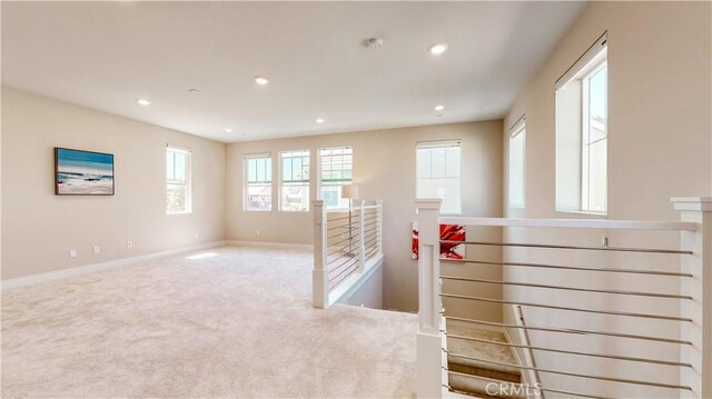 71 Einstein Way, Irvine, CA 92618 - hallway featuring an upstairs landing, carpet flooring, recessed lighting, and baseboards