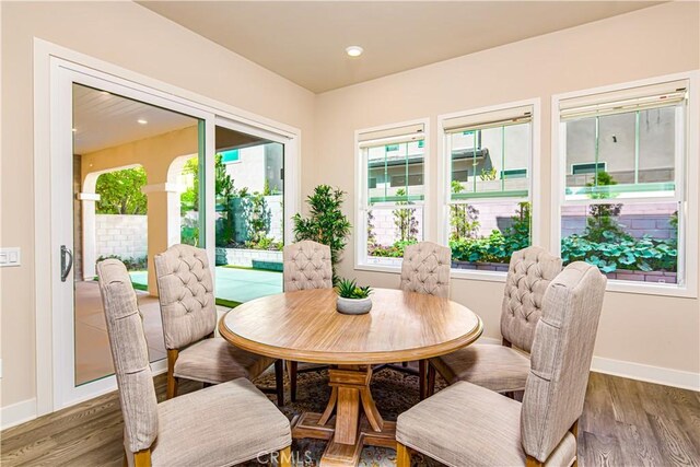 71 Einstein Way, Irvine, CA 92618 - dining area with healthy amount of natural light, wood finished floors, and baseboards