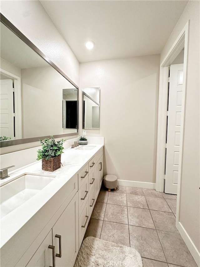 71 Einstein Way, Irvine, CA 92618 - full bath with double vanity, baseboards, tile patterned flooring, and recessed lighting