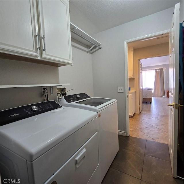 1822 Glover St, Redlands, CA 92374 - washroom featuring washing machine and clothes dryer, cabinet space, and tile patterned flooring