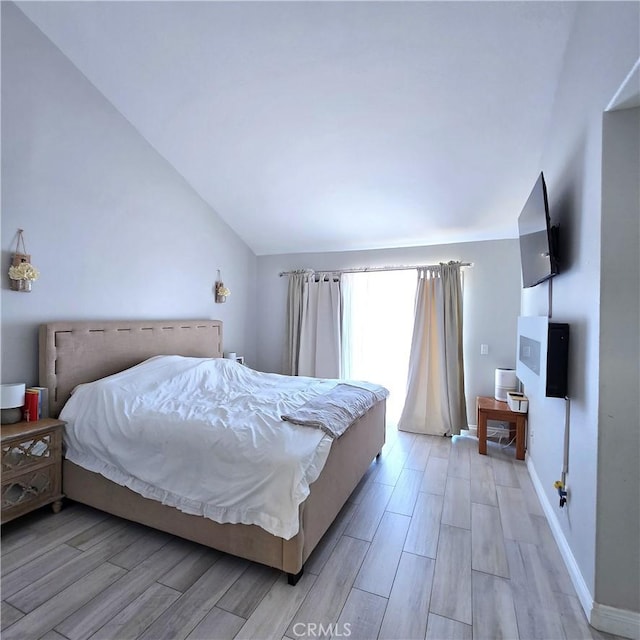 1822 Glover St, Redlands, CA 92374 - bedroom with light wood-style floors, lofted ceiling, and baseboards