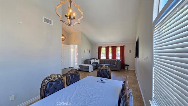 1822 Glover St, Redlands, CA 92374 - dining room featuring a chandelier, high vaulted ceiling, and baseboards