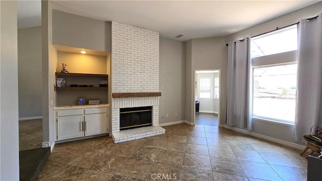 1822 Glover St, Redlands, CA 92374 - unfurnished living room with a brick fireplace and baseboards