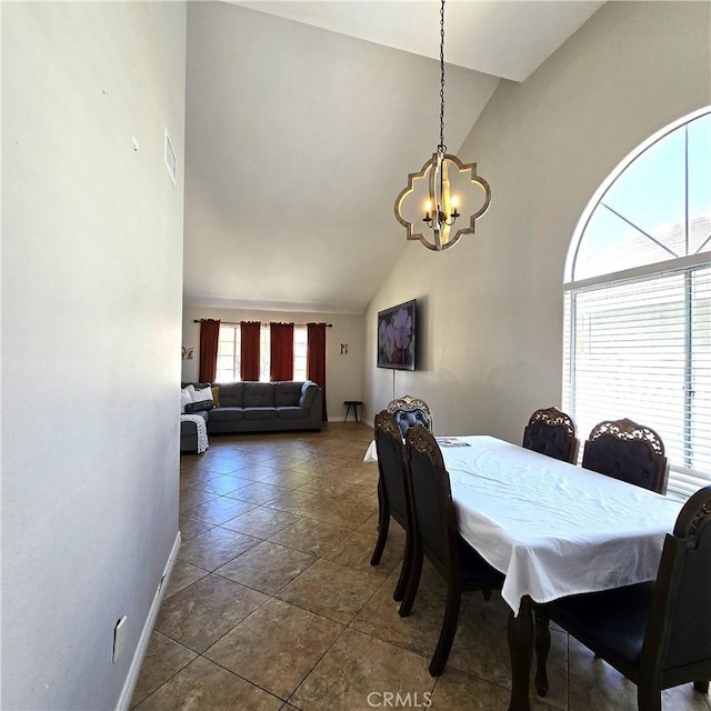 1822 Glover St, Redlands, CA 92374 - dining room featuring a chandelier, dark tile patterned flooring, high vaulted ceiling, and baseboards