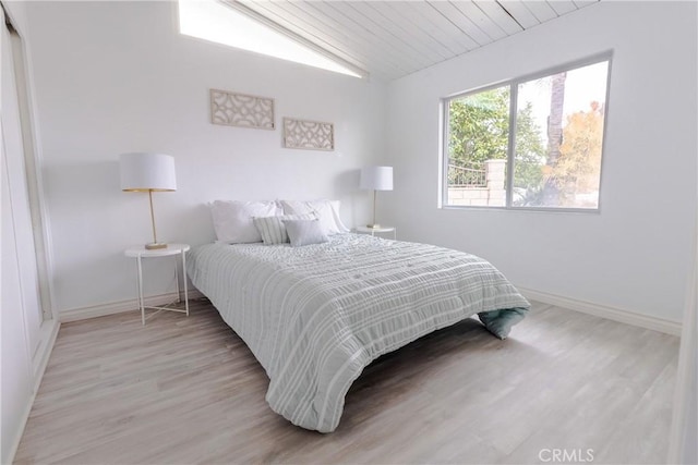 5921 Los Ramos Cir, Buena Park, CA 90620 - bedroom with vaulted ceiling and light wood finished floors