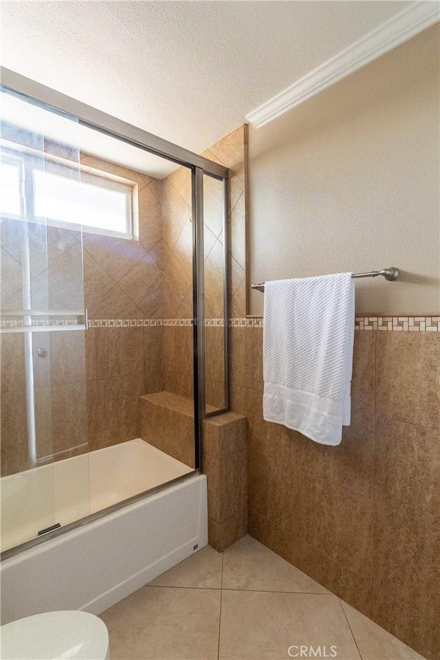 5921 Los Ramos Cir, Buena Park, CA 90620 - bathroom with tile patterned flooring, combined bath / shower with glass door, and a textured ceiling