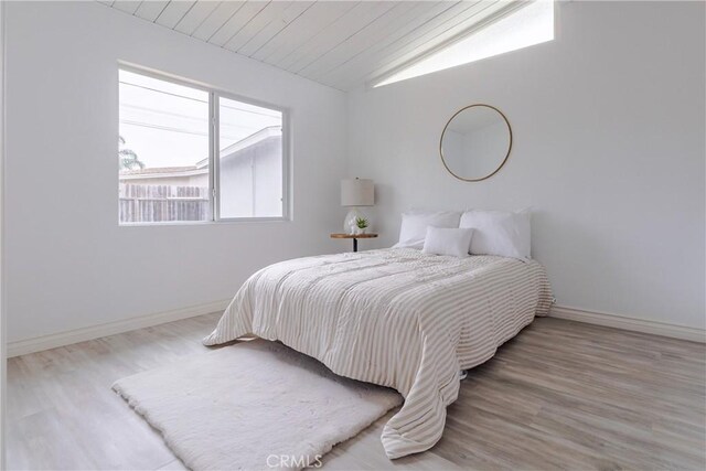 5921 Los Ramos Cir, Buena Park, CA 90620 - bedroom with lofted ceiling, wood finished floors, and wooden ceiling