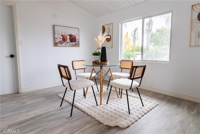 5921 Los Ramos Cir, Buena Park, CA 90620 - dining space featuring lofted ceiling and light wood-style flooring