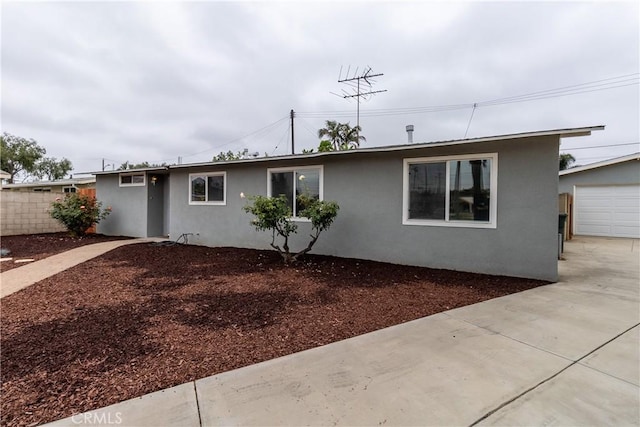 5921 Los Ramos Cir, Buena Park, CA 90620 - ranch-style home featuring stucco siding, a garage, an outdoor structure, and concrete driveway