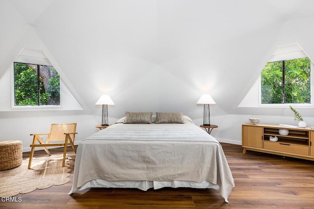 4991 Coringa Dr, Highland Park, CA 90042 - bedroom featuring multiple windows, lofted ceiling, wood finished floors, and baseboards