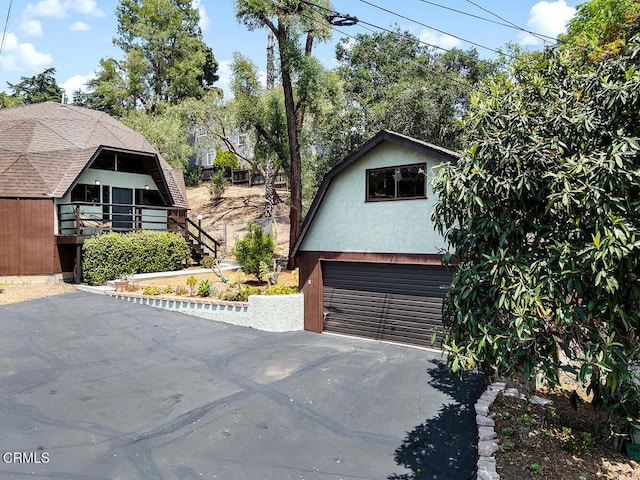 4991 Coringa Dr, Highland Park, CA 90042 - view of front of house featuring stucco siding and driveway