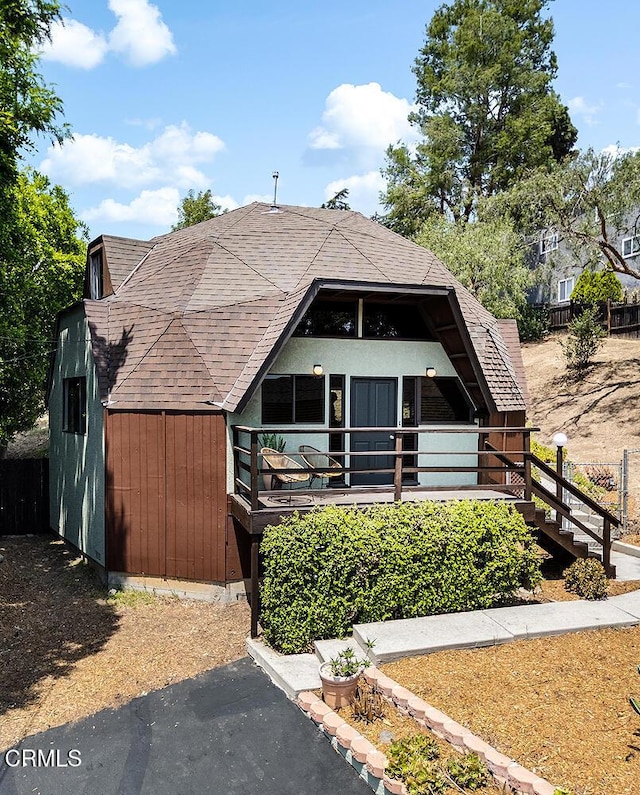 4991 Coringa Dr, Highland Park, CA 90042 - view of front facade featuring roof with shingles and stairway