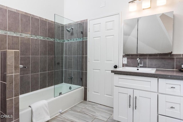 4991 Coringa Dr, Highland Park, CA 90042 - bathroom with vanity, tub / shower combination, and tasteful backsplash