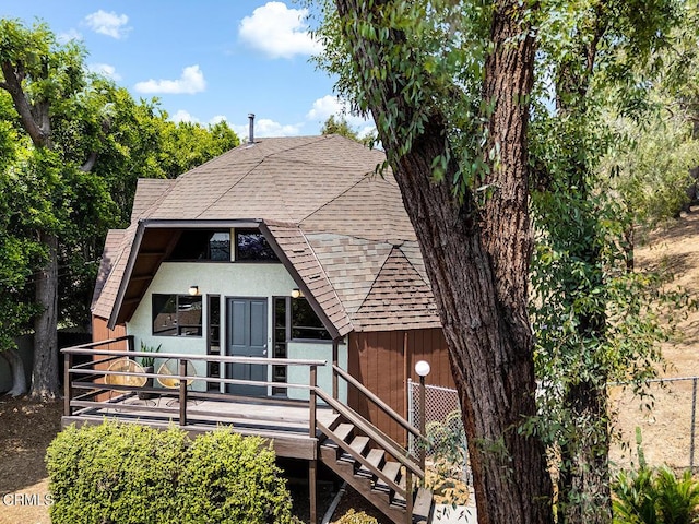 4991 Coringa Dr, Highland Park, CA 90042 - view of front facade with a shingled roof, stairs, and stucco siding
