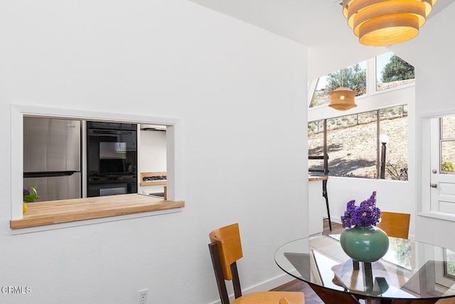 4991 Coringa Dr, Highland Park, CA 90042 - dining room with wood finished floors and baseboards