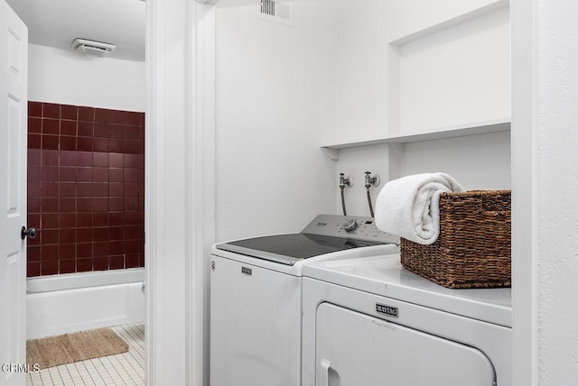 4991 Coringa Dr, Highland Park, CA 90042 - washroom featuring separate washer and dryer and tile patterned floors