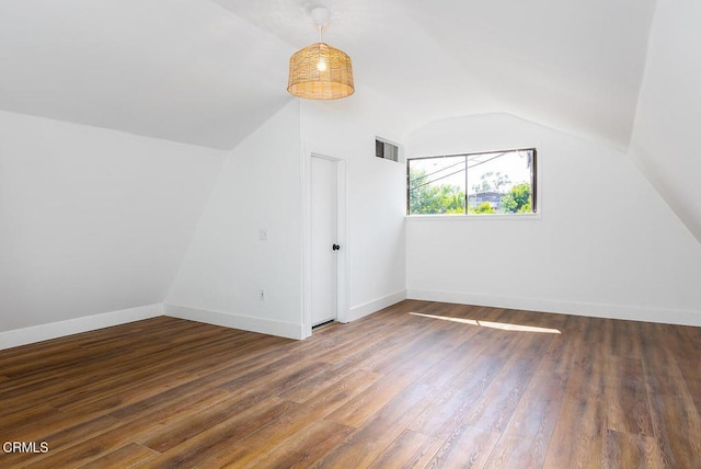 4991 Coringa Dr, Highland Park, CA 90042 - bonus room with vaulted ceiling, wood finished floors, and baseboards
