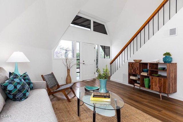 4991 Coringa Dr, Highland Park, CA 90042 - living area with baseboards, stairs, a towering ceiling, and wood finished floors