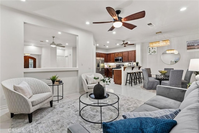 27831 Silverton Ct, Valencia, CA 91354 - living room featuring a ceiling fan, recessed lighting, and light marble finish floors