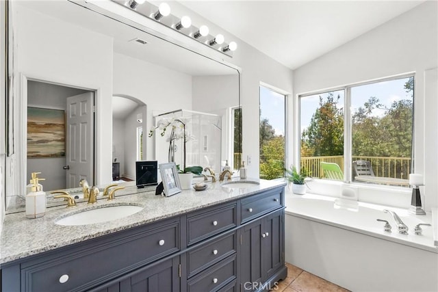 27831 Silverton Ct, Valencia, CA 91354 - full bath featuring double vanity, a shower stall, a garden tub, lofted ceiling, and tile patterned flooring