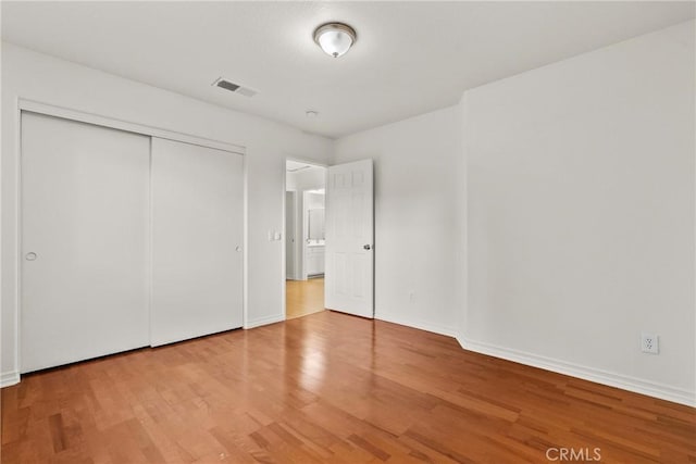 27831 Silverton Ct, Valencia, CA 91354 - unfurnished bedroom featuring wood finished floors and a closet