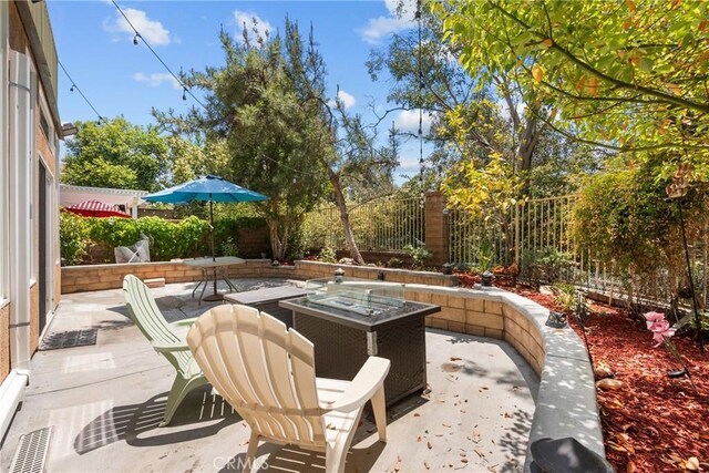 27831 Silverton Ct, Valencia, CA 91354 - fenced backyard with a patio and a fire pit