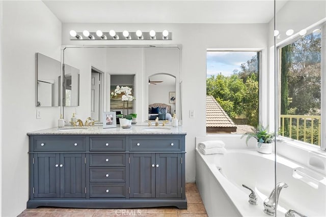 27831 Silverton Ct, Valencia, CA 91354 - full bathroom with double vanity, a garden tub, ensuite bath, and tile patterned floors