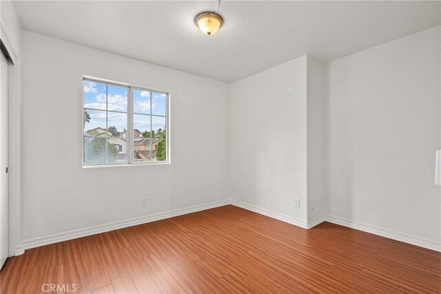 27831 Silverton Ct, Valencia, CA 91354 - empty room featuring wood finished floors and baseboards